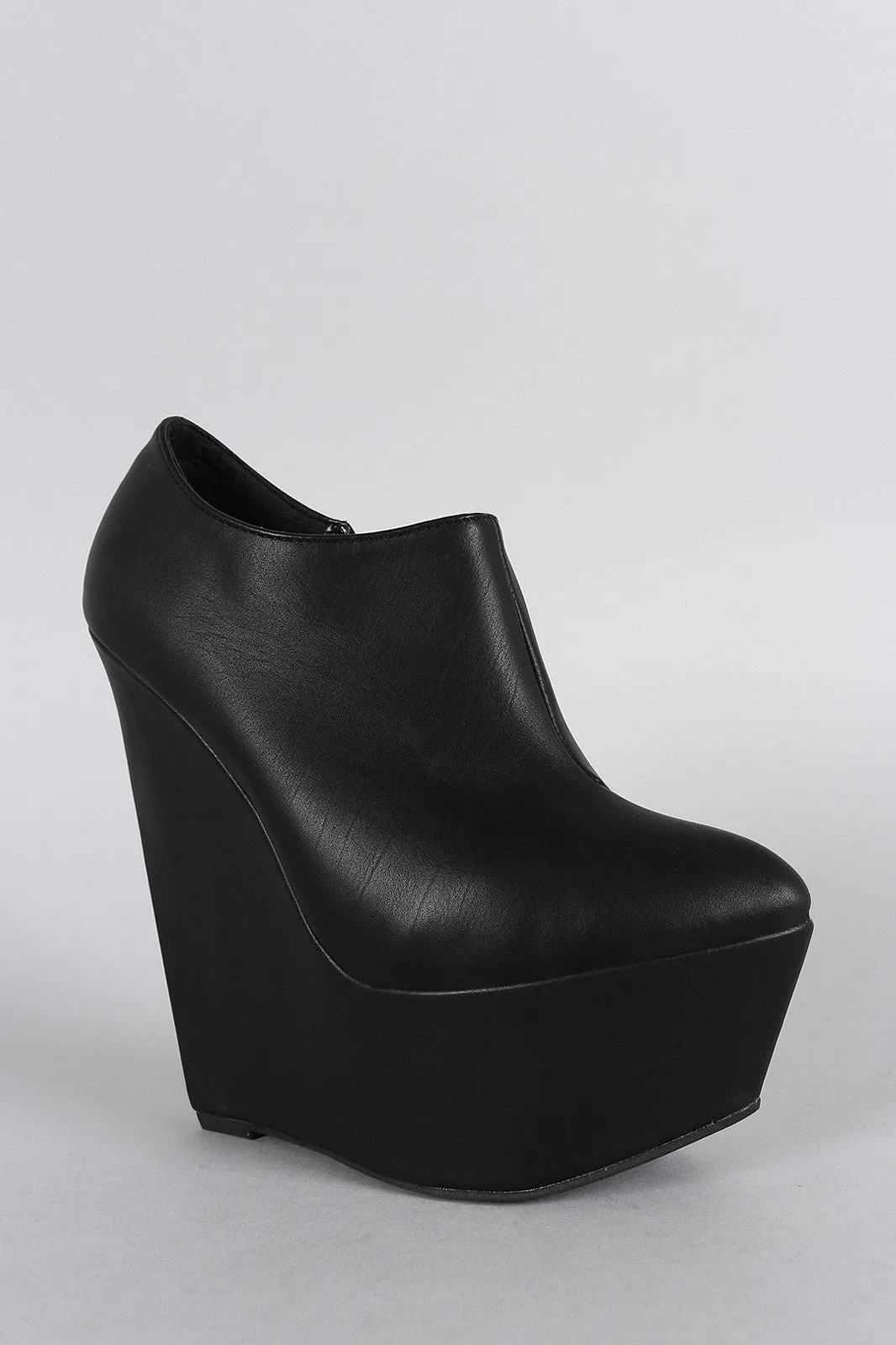 Narrow Platform Heights Wedge Booties