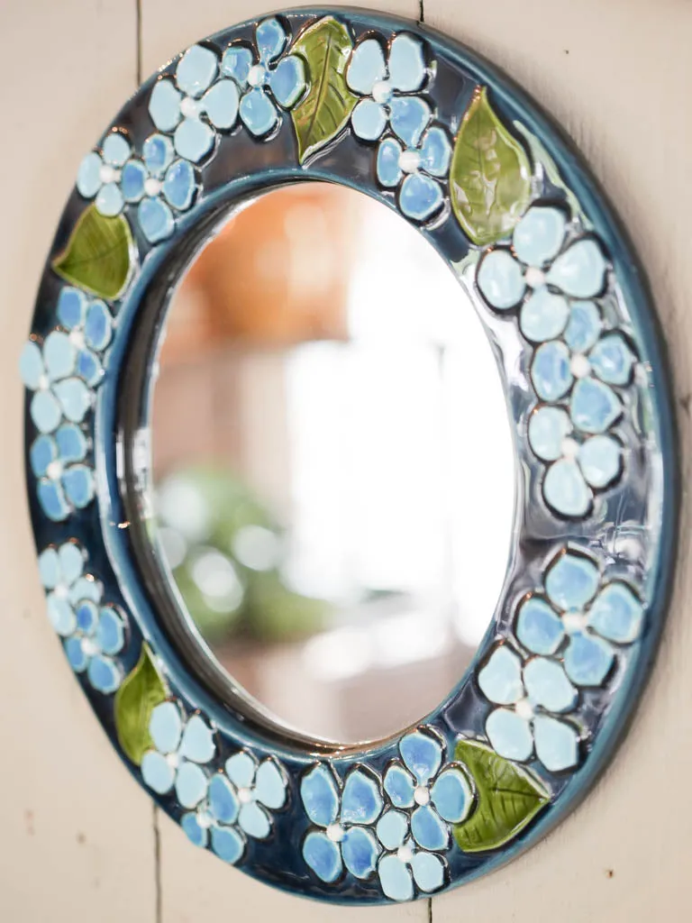 Round mid-century mirror w / blue flowers - Mithe Espelt (1924-2021) - 13½"