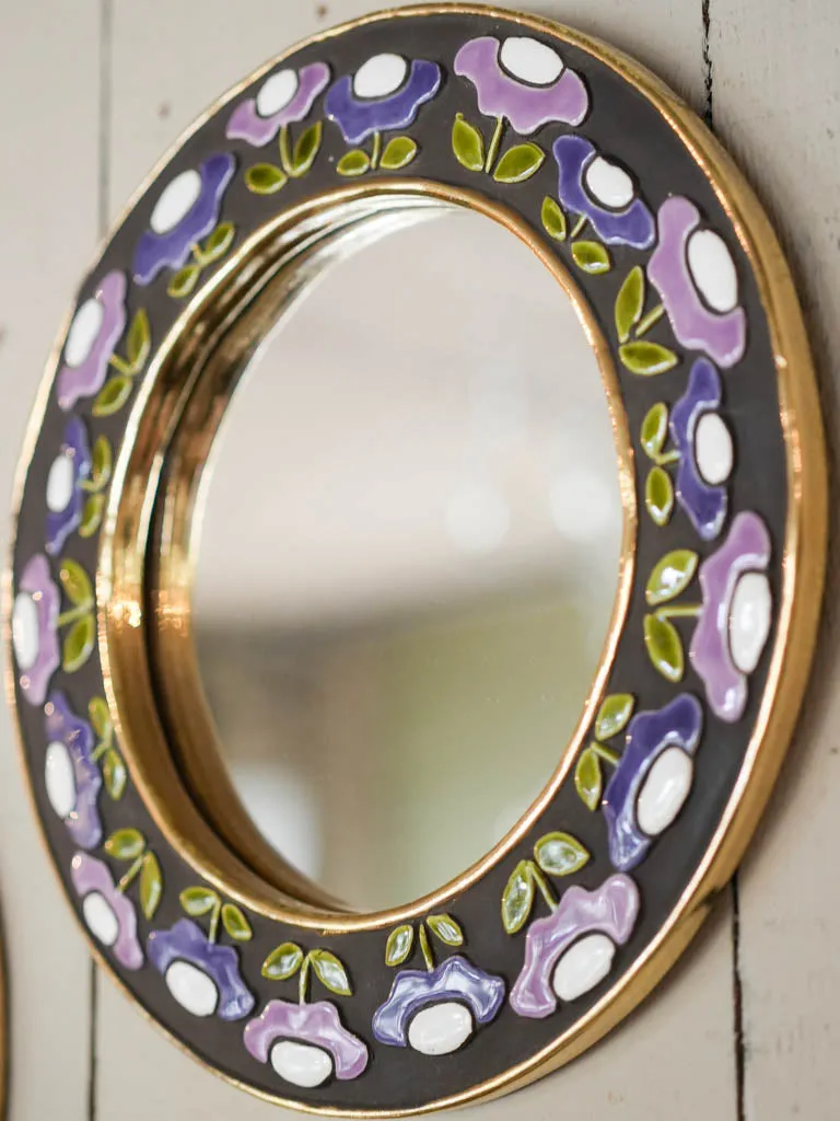 Round mid-century modern mirror w/ purple flowers - Mithe Espelt (1924-2021) - 10¾"